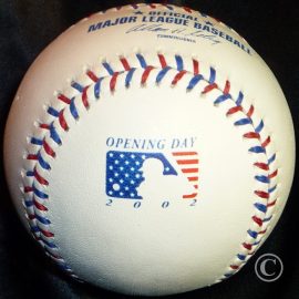 2002 Rawlings MLB Opening Day A Rawlings 2002 Major League Baseball with specially stamped Opening Day American Flag Logo and red and blue stitches.